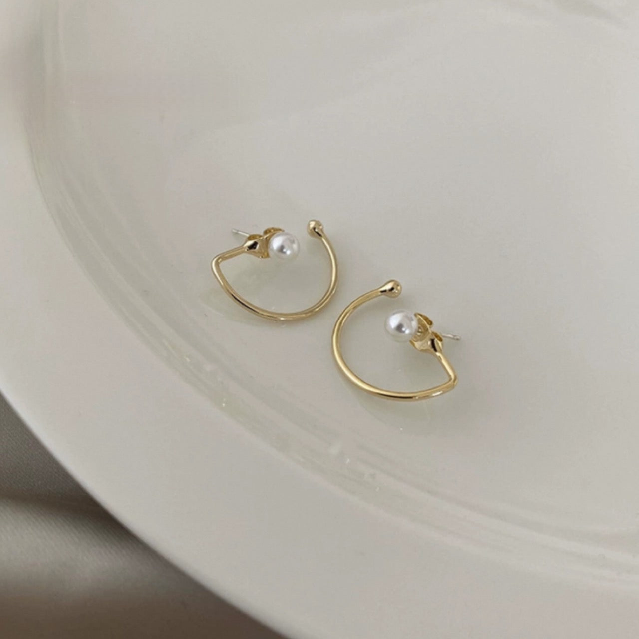 half hook pearl pierce