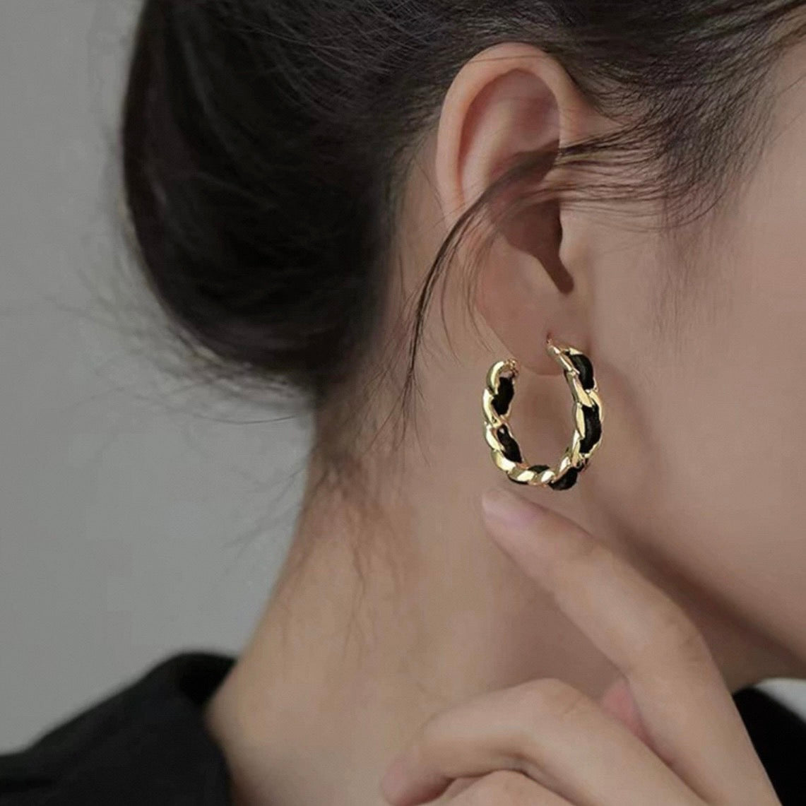 elegant black twist pierce