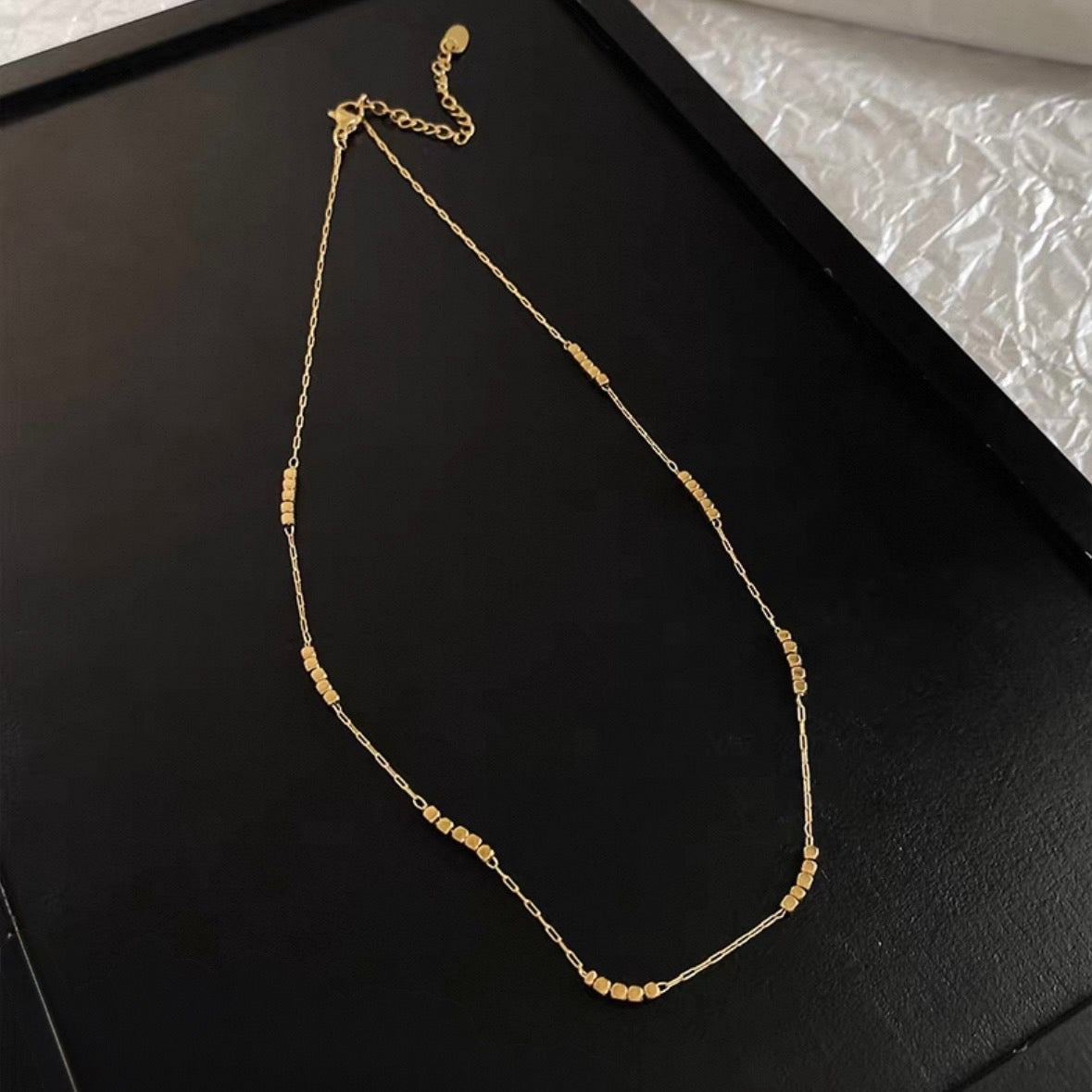 tiny dot gold necklace