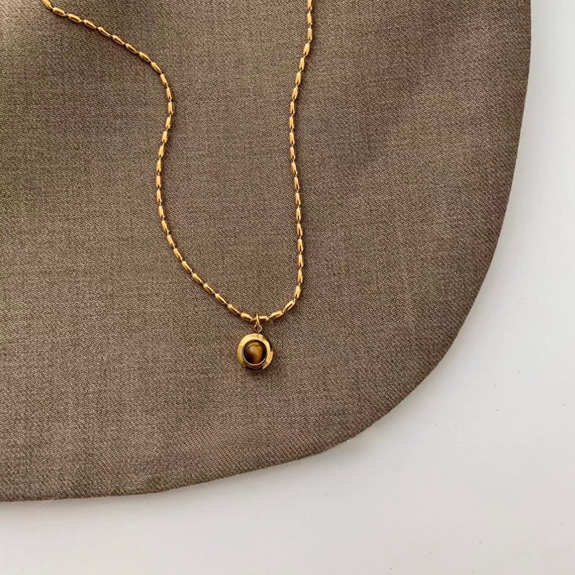 tiger eye orbit necklace