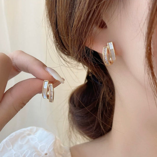 white & gold earring
